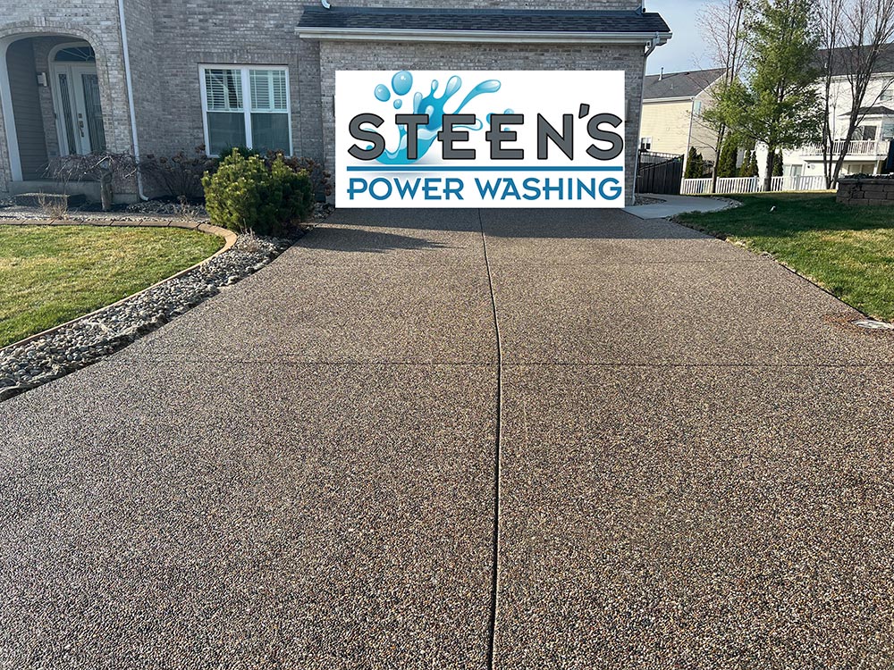 Aggregate concrete driveway cleaning and sealing on river city pass in ofallon mo